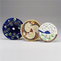 Three Victorian MAJOLICA dessert plates, circa 1870-1880, comprising an English cobalt blue groun…