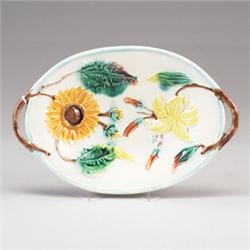 WARDLE AND COMPANY MAJOLICA bread dish, circa 1875, decorated with a sunflower and lily. Restorat…
