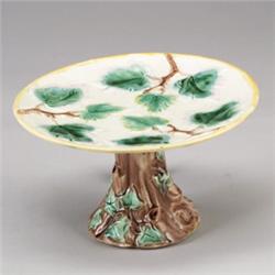 ETRUSCAN MAJOLICA center, circa 1875, in maple leaf pattern, with rustic stem. Impressed monogram…