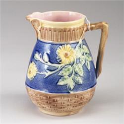 ETRUSCAN MAJOLICA pitcher, circa 1875, with blossom design on cobalt blue ground and butterfly mo…