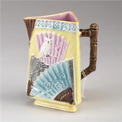 EUREKA POTTERY MAJOLICA triangular pitcher, circa 1880, patterned with Japanese fans and owls on …