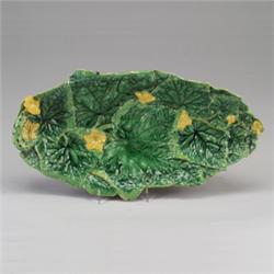 GEORGE JONES MAJOLICA cucumber tray, circa 1868, modeled as foliage with yellow blossoms and cucu…