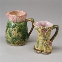 Two ENGLISH MAJOLICA jugs, circa 1875, a pond lily and wheat-sheaf design with green and yellow g…