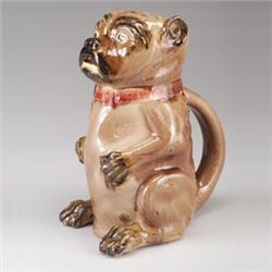 ENGLISH MAJOLICA pug dog jug, circa 1880, modeled as a seated pug in shades of brown, pink interi…