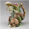 Image 1 : ENGLISH MAJOLICA monkey jug, circa 1880, modeled as a seated monkey holding a stalk of bamboo, pi…