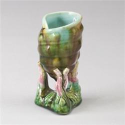 ENGLISH MAJOLICA vase, circa 1875, modeled as a naturalistic shell supported by three branches of…