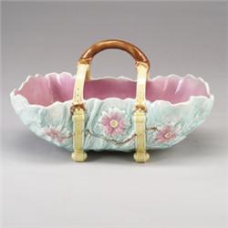 ENGLISH MAJOLICA basket, circa 1880, leaf-form, held by a double strap handle, pale blue ground a…