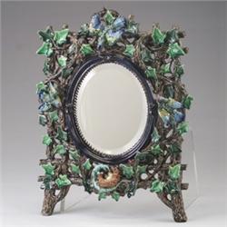 HUGO LONITZ MAJOLICA dressing mirror, circa 1885, the elaborate frame modeled in the form of bran…