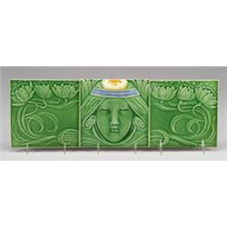 Fine three-tile frieze by ERNST TEICHERT (Germany) molded with a woman's head with yellow waterli…