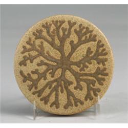 Fine and rare MARBLEHEAD circular trivet tile decorated with an incised sea plant in matte dark b…