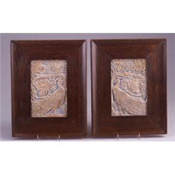 Pair of BATCHELDER tiles molded with peacocks facing each other under grape vines, and rubbed wit…