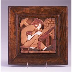 UNITILE red clay tile molded with a draughtsman at work, and glazed in white, red, and black, and…