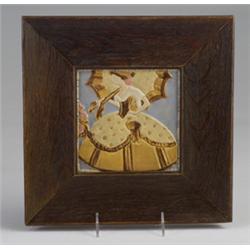 ROOKWOOD FAIENCE tile molded with a 19th C. belle with hoop skirt and parasol, in matte amber and…