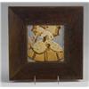 Image 1 : ROOKWOOD FAIENCE tile molded with a 19th C. belle with hoop skirt and parasol, in matte amber and…