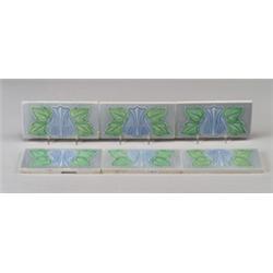 Six GILLIOT & Cie (Hemixem, Belgium) border tiles, decorated in cuenca with blue blossoms and gre…