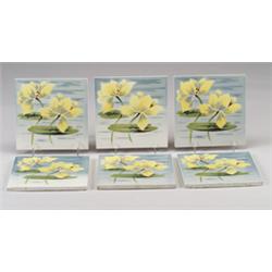 Six SAINT-AMAND tiles (France), stencil-decorated with yellow waterlilies and green leaves on blu…