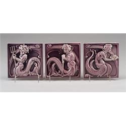Three Continental tiles molded with sea gods, one holding an anchor, one a platter of fruit, and …