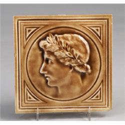 J. AND J.G. LOW tile with a Classical head with wreath in profile, under a clear glossy amber gla…