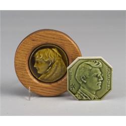 Two small portrait tiles, one a circular stove-tile by TRENT with a young girl in profile under a…