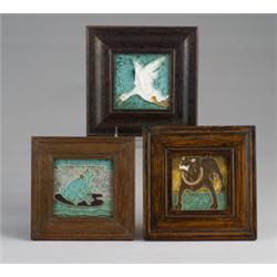 Three early DE PORCELEYNE FLES tiles decorated in cuenca with animals: a bulldog, a frog on a lil…