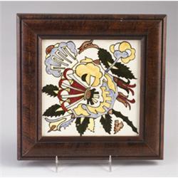 ROZENBURG tile underglaze-painted with a stylized floral display in yellow, green, red and blue, …