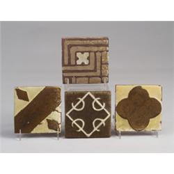 Four GRUEBY geometric tiles in assorted patterns, in tones of brown and ivory. Unmarked. 4" sq. e…