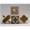 Image 1 : Four GRUEBY geometric tiles in assorted patterns, in tones of brown and ivory. Unmarked. 4" sq. e…
