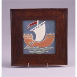 MOSAIC tile molded with Viking ship in brown, white, and red semi-matte glaze on a blue-green gro…