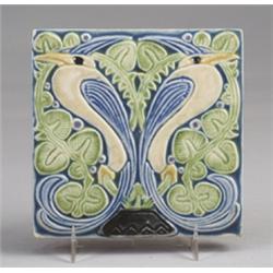 Fine ROOKWOOD trivet tile, 1921, embossed with a pair of stylized birds of paradise in amber and …