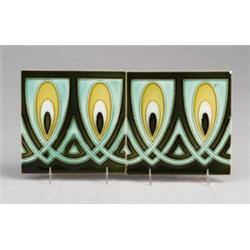 Two German Art Nouveau frieze tiles decorated in cuenca with a chain pattern of peacock feathers,…