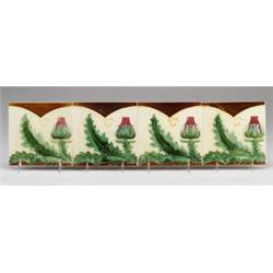 Four fine Belgian frieze tiles with red thistles and green leaves in cuenca, on ivory and brown. …