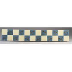 Five GILLIOT & Cie. (Hemiksem, Belgium) tiles divided in quadrants, two with brown berries on blu…