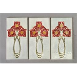 Three pairs of German tiles with stylized triple red and amber blossoms on looping celadon stems,…