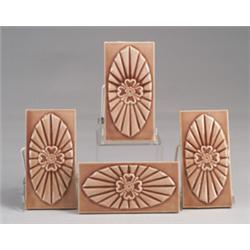 Four OLD BRIDGE (N.J.) border tiles, each embossed with a dogwood blossom on an oval "cushion", a…