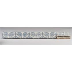 Ten Belgian border frieze tiles, transfer-decorated with pairs of poppies in blue on white. A few…