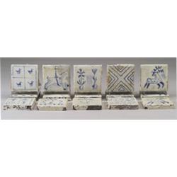 Fifteen Continental faience tiles, tin-glazed in thirteen different designs of birds, plants, ani…