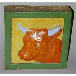 Fine and unusual architectural faience tile molded in relief with a bull in matte brown with glossy