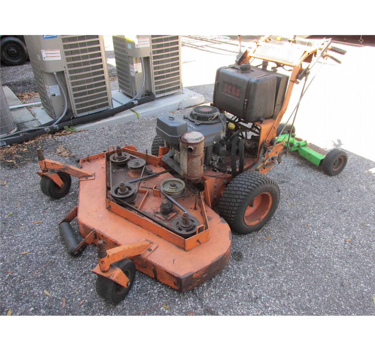 Scag walkbehind mower, sulky, 2 yr. old Kawasaki engine, 52" deck