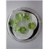 Image 1 : Assorted cut green Peridot gemstones