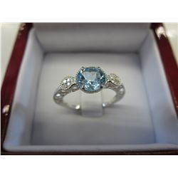 Blue topaz one carat ring set with 8 diamonds