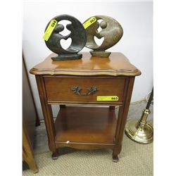 Wooden end table with drawer and shelf.