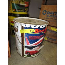 Pail of airport grade driveway sealant