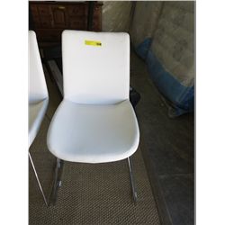 White leather armless side chair
