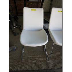 White leather armless side chair