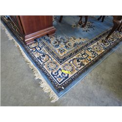 Blue and ivory wool area carpet