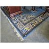 Image 1 : Blue and ivory wool area carpet