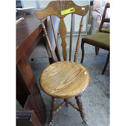 Carved back wooden chair with adjustable seat