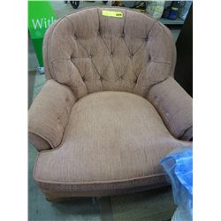 Upholstered swivel chair with storage ottoman
