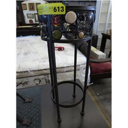Metal plant stand with ceramic insert decorations