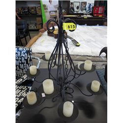 Hanging metal chandelier light with candles